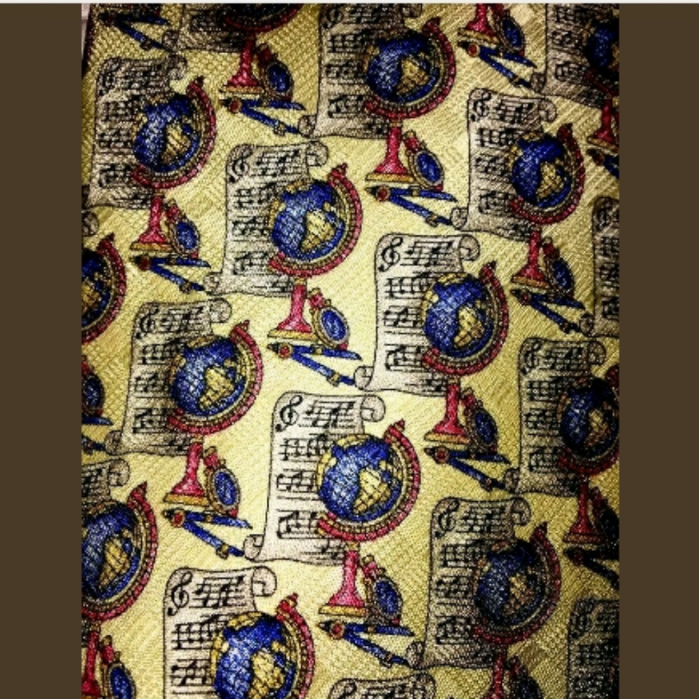Globe tie with music notes on paper